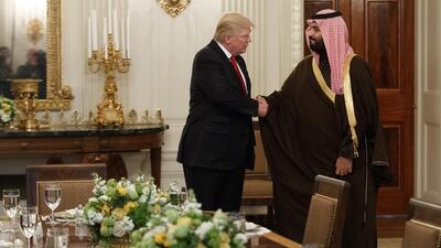 US president Donald Trump shakes hands with Saudi Deputy Crown Prince Mohammed bin Salman in the state dining room of the White House in Washington on March 14, 2017. Evan Vucci, File / AP Photo