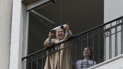 A woman standing on her balcony, reaches out to catch a rose delivered to her via a drone on Mother's day, in the Lebanese coastal city of Jounieh, north of the capital Beirut, as people remain indoors in an effort to limit the spread of the novel coronavirus. In a quiet Lebanese town under lockdown over the novel coronavirus, a drone buzzed towards a balcony on Saturday to deliver a red rose to a mother grinning in surprise. The COVID-19 pandemic may have put a damper on Mother's Day this year, but three students have come up with a novel service to celebrate the occasion without flouting social distancing restrictions. AFP