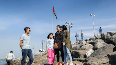 Chinese tourists enjoying the Abu Dhabi sights at the UAE Heritage Village. Victor Besa / The National