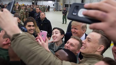 US President Donald Trump greets members of the US military during a stop at Ramstein Air Base in Germany. AFP
