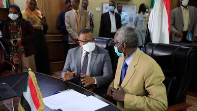 Sudan's Minister of Irrigation and Water Resources Yasser Abbas, right, and Foreign Minister Omar Gamar Al Din discuss a point during an online meeting with their Egyptian and Ethiopian counterparts on January 10, 2020. AFP