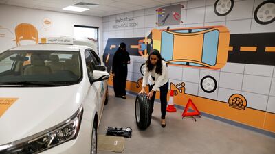 Practical lessons include how to change a tyre. Ahmed Jadallah / Reuters