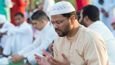 Worshippers celebrate Eid Al Fitr outside Sheikh Zayed Mosque early on Tuesday morning.