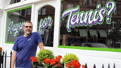 Mathew Swan has painted a Wimbledon-themed sign on the window of the Dog and Fox pub in the London suburb, with fans to return for this year’s tournament. All photos: Mark Chilvers for The National