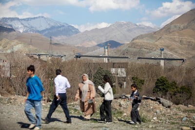 People view the B1 bridge in Karaj, west of Tehran, after it was damaged by an air strike. Getty Images