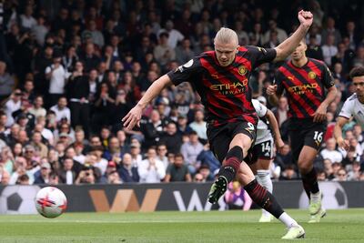 Manchester City's Erling Haaland scores from the spot against Fulham, one of his 36 Premier League goals this season. AFP