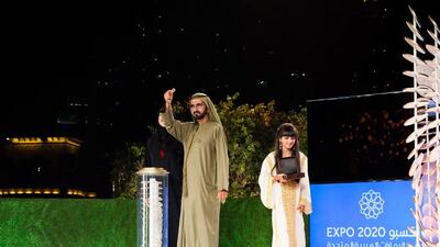 Sheikh Mohammed bin Rashid, Vice President and Ruler of Dubai holds aloft the ancient ring, which was the inspiration behind the logo for Expo 2020 Dubai. Anna Nielsen / The National