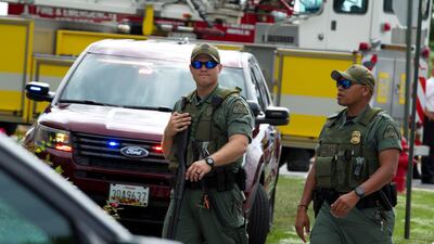 Maryland police officers patrol the area after multiple people were shot at at The Capital Gazette newspaper in Annapolis, Maryland. AP Photo/Jose Luis Magana