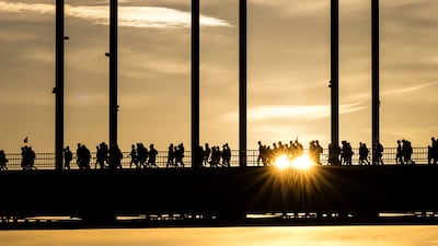 People cross the Waal Bridge on the first day of the annual Nijmegen Four Days Marches in the Netherlands. AFP