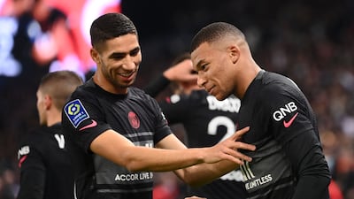 Kylian Mbappe celebrates with Moroccan defender Achraf Hakimi after scoring the winning penalty. AFP