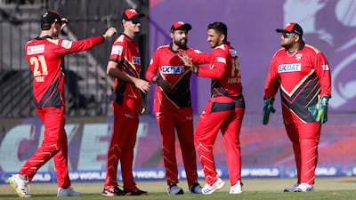 Khuzaima Tanveer of Desert Vipers celebrates with his teammates after clean bowling Tim Southee of Sharjah Warriorz. ILT20