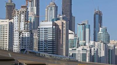 A Dubai Metro train pulls out of the Jumeirah Lakes Towers station.