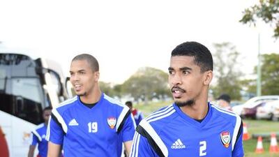 Hassan Ibrahim, right, and penalty hero Ismail Ahmed, left, make their way to training.