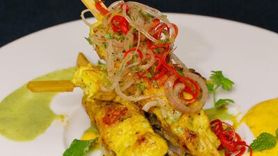 Chicken tikka skewers with chilli minted yogurt. Victor Besa for The National