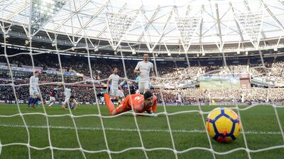 West Ham United's Marko Arnautovic celebrates scoring as Chelsea goalkeeper Thibaut Courtois looks on. Tony O'Brien / Reuters