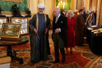 Sultan Haitham wearing a grey worsted wool abaya with ornate golden embroidery. Reuters