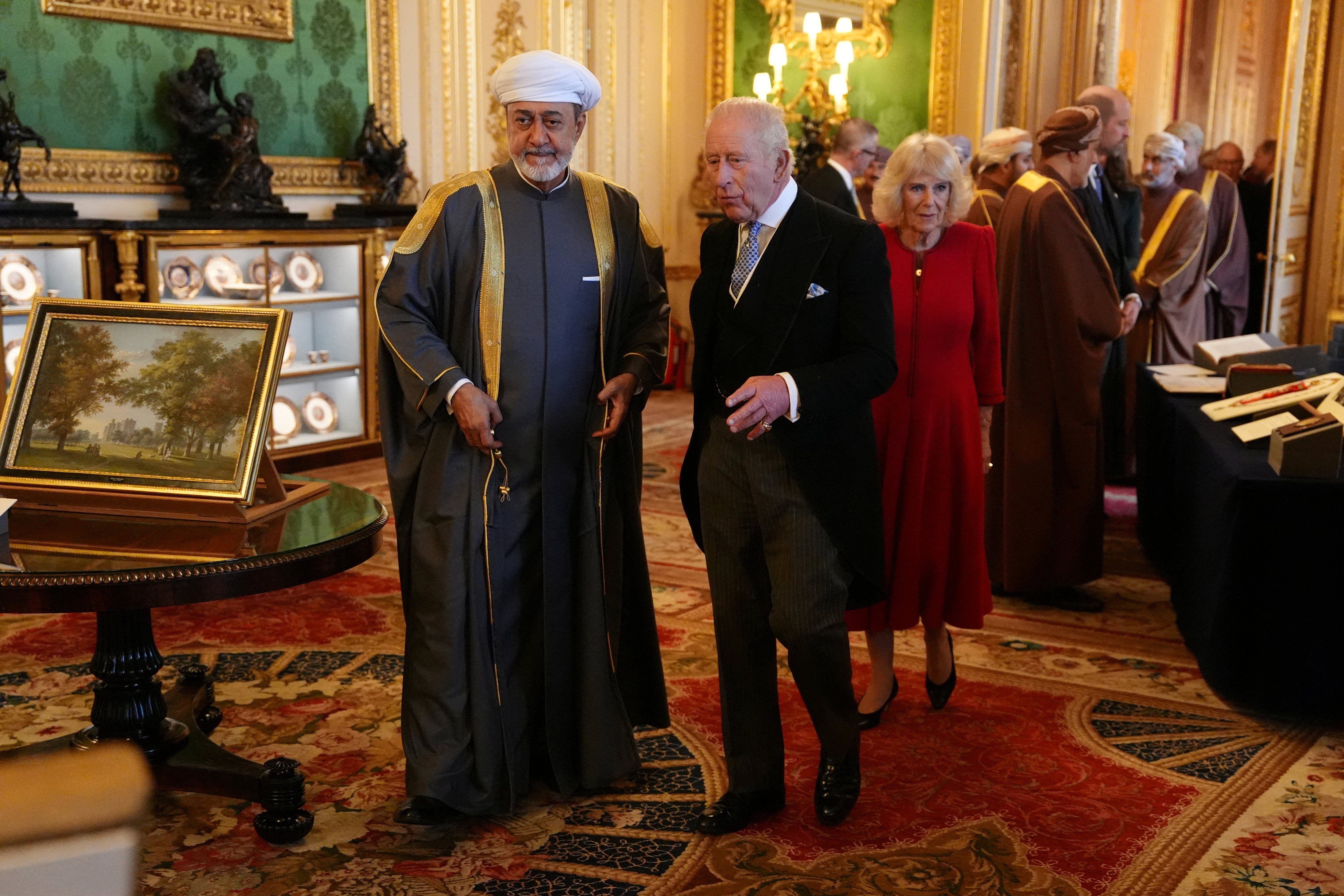 Sultan Haitham wearing a grey worsted wool abaya with ornate golden embroidery. Reuters