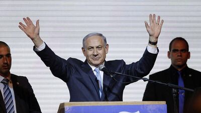 Israeli prime minister, Benjamin Netanyahu, waves to supporters at the Likud party headquarters in Tel Aviv. Netanyahu claimed victory in Israel's election. Amir Cohen / Reuters