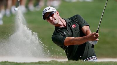 Adam Scott of Australia plays a bunker shot on the first hole during the first round of the PGA Tour Championship at East Lake Golf Club on September 19, 2013 in Atlanta, Georgia. Kevin C. Cox / Getty Images