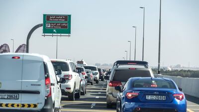 A line of cars waiting to enter the Seha Vaccination centre at the Dubai Parks grounds near the border of Dubai and Abu Dhabi. Antonie Robertson/The National