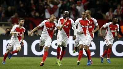 Kylian Mbappe, second left, scored the opening goal for Monaco on their way to a 3-1 second leg victory which ensured their place in the Uefa Champions League quarter-finals. Guillaume Horcaiuelo / EPA