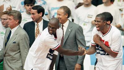 USA's Magic Johnson, right, and Michael Jordan shake hands near the end of their win over Croatia in the gold medal game in men's basketball match at the Summer Olympics in Barcelona. AP