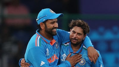 India's Kuldeep Yadav celebrates with Rohit Sharma after taking the wicket of Afghanistan's Hashmatullah Shahidi. Reuters
