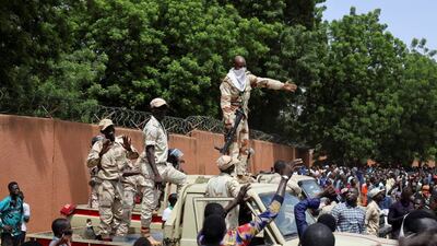 Security forces attempt to disperse pro-junta demonstrators gathered outside the French embassy in Niamey, the capital of Niger. Reuters