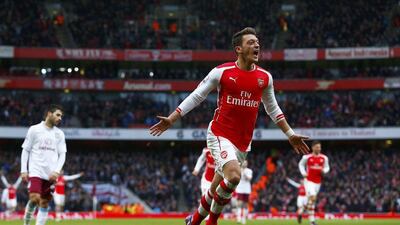 Left midfield: Mesut Ozil (Arsenal). The fit-again German scored one goal, made another and showed his quality as Arsenal ran riot against Aston Villa. Eddie Keogh / Reuters