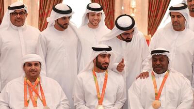 Sheikh Mohammed bin Rashid and Sheikh Hamdan bin Mohammed stand for a photo with members of the UAE team for the 2016 Rio Paralympic Games at Zabeel Palace. L-R: Abdulla Sultan Alaryani, who won three silver medals in shooting, Mohammed Al Hammadi, who won the gold medal for the T34 800m wheelchair race, and Mohammed Khalaf, who won the gold medal for the Men’s 88kg Group A in weightlifting. Wam