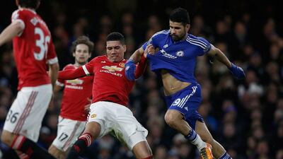 Manchester United's Chris Smalling, left, clashes with Chelsea's Diego Costa during their English Premier League match at Stamford Bridge in London on February 7, 2016. AFP / ADRIAN DENNIS
