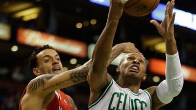 Boston's Leandro Barbosa drives towards the basket under pressure from Matt Barnes of the Los Angeles Clippers.