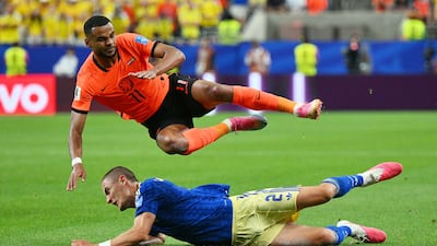 Gustaf Lagerbielke of Sweden tackles Cody Gakpo of Netherlands in Houston. EPA