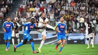 Gonzalo Higuain scores Juventus' second goal. Reuters