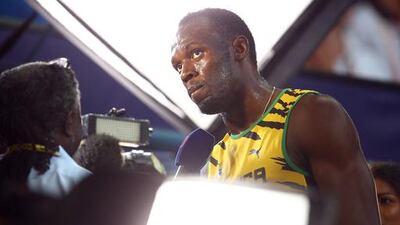 Usain Bolt of Jamaica speaks to the media after competing in the men's 100 metres heats during the 14th IAAF World Athletics Championships at Luzhniki Stadium on August 10, 2013, in Moscow, Russia. Paul Gilham / Getty Images