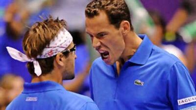 Michael Llodra and Arnaud Clement celebrate victory.