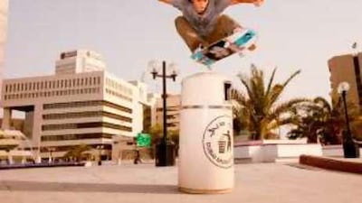 Evan Collisson, a graphic designer, shows his skills with a skateboarding trick called an ollie.