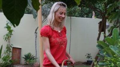 Adele Nigrini maintains her garden with waste water cleaned by her own recycling system, below.