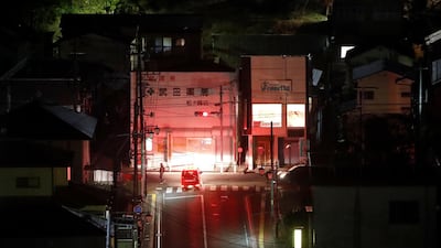 A firefighter vehicle patrols streets following a strong earthquake in Iwaki, Fukushima prefecture, Japan February 13, 2021. REUTERS