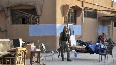 A man secures an area that was hit by a suicide bombing at the Kurdish Security Forces Centre (Asayish) at Qamishli, Syria. The Al Qaeda-linked Islamic State of Iraq and the Levant have claimed responsibility. Rodi Said / Reuters