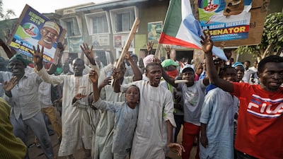 Supporters of President Muhammadu Buhari celebrate the announcement of results favoring his All Progressives Congress (APC) party in their state, anticipating victory, in Kano, northern Nigeria Monday, February 25, 2019. AP