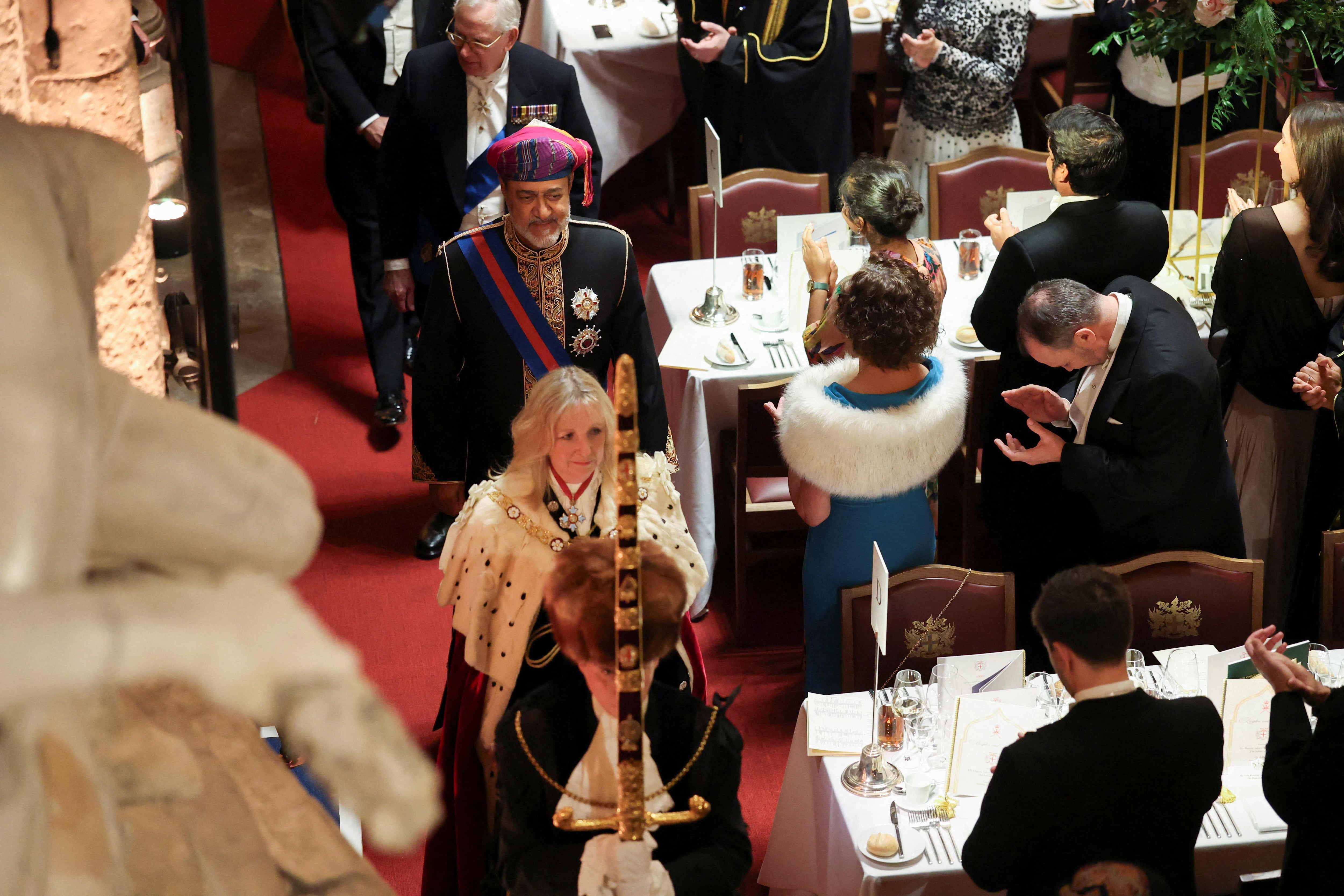 Lady Mayor Susan Langley and Oman's Sultan Haitham take their seats during a state banquet at the Guildhall in the City of London. AFP