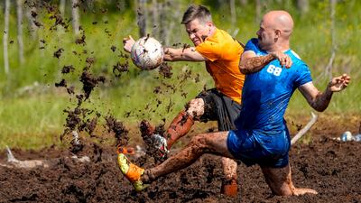 Players in action during the Swamp Soccer Championships 2025 in Hyrynsalmi, Finland. EPA
