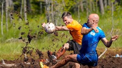 Players in action during the Swamp Soccer Championships 2025 in Hyrynsalmi, Finland. EPA