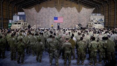 President Donald Trump accompanied by first lady Melania Trump speaks at a hanger rally at Al Asad Air Base, Iraq. AP Photo