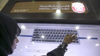 Through touchscreen technology, users can inquire about the status of a certain case by entering its number or the whereabouts of a case file. Silvia Razgova / The National