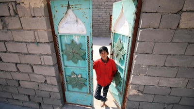 Informal housing settlements are flourishing in the oil-rich province of Basra, as Iraqis who have failed to find work in the energy industry and internal refugees struggle to find affordable housing. Haidar Mohammed Ali / AFP