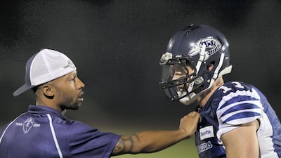 Barracudas coach Zavier Cobb talks with QB David Pearce during the Desert Bowl. Chris Whiteoak / The National
