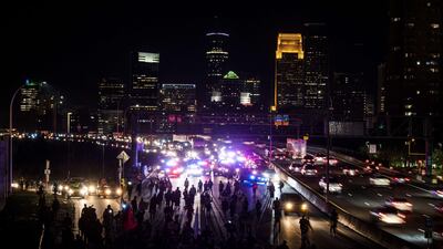 Demonstrators march on to highway I-94 in Minneapolis, Minnesota. AFP
