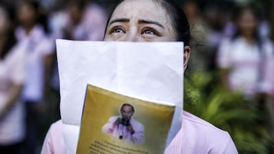 A Thai well-wisher weeps while praying for Thai King Bhumibol Adulyadej who died on October 13, 2016. Rungroj Yongrit/EPA